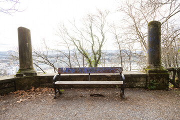 empty bench between columns in winter