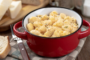 Macaroni and cheese in a red bowl
