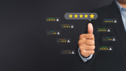 Customer service and satisfaction surveys concept. Businessman thumbs up on the five-star icon to give a rating of very impressed