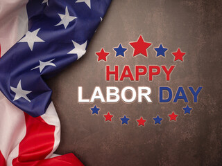 Happy labor day text over a cement floor background and American Flag.