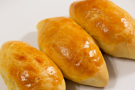 Traditional turkish breakfast savory pastry food close-up top view. It is known as Poaca or Poğa&ccedil;a in Turkish. It is a very popular breakfast food. Cheese, olives, sausage can be put inside.