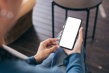 cell phone blank white screen mockup.hand holding texting using mobile on desk at office.background empty space for advertise.work people contact marketing business,technology