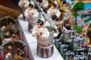 Typical Neapolitan objects, pulcinella and the coffee machine, for sale in the stalls of San Gregorio Armeno.
