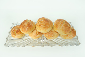 Homemade spelled rolls on an old glass plate 