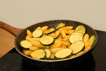 Finger shaped potato dumplings (noodles), Schupfnudeln, with zucchini in a pan