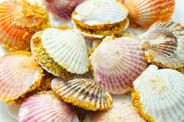 Mini coquilles St. Jacques, Natural scallop shells filled with Patagonian scallops and Thermidor sauce topped with a ciabatta breadcrumb topping