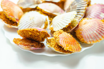 Mini coquilles St. Jacques, Natural scallop shells filled with Patagonian scallops and Thermidor sauce topped with a ciabatta breadcrumb topping