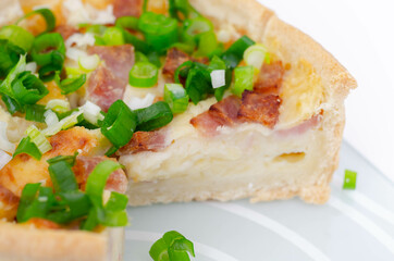 Quiche Lorraine, smoked bacon with medium  and mature cheddar cheese and egg quiche filling in a shortcrust pastry