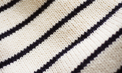 Stiped knitted textile. Warm sweater fabric 