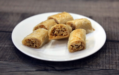 A white plate full of freshly baked Lebanese baklawa.