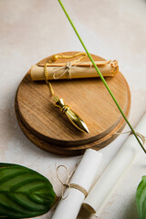 divination pendulum on a wood disk with plants