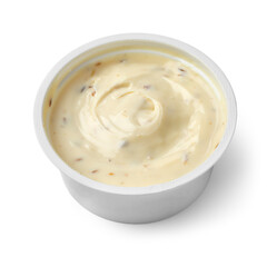 Plastic dish with low fat Goats cream cheese and cumin close up isolated on white background