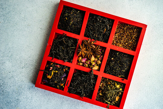Overhead view of a box of assorted loose leaf teas on a table
