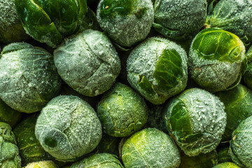 Fototapeta na wymiar frozen brussels sprouts background closeup