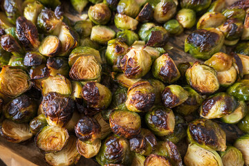 oven baked sliced brussels sprouts on baking tray closeup