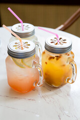 Three mason jars with fresh ice cold lemonade drink