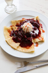 Freshly baked pancakes crepe served with berries