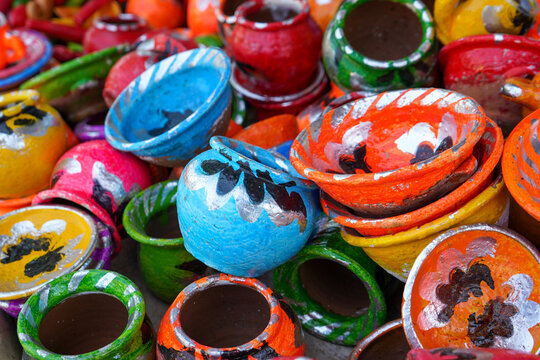 Handicrafts made from clay painted in colorful shapes in the form of kitchen utensils. These toys are widely sold in Indonesia on the roadside during traditional events or festivals.