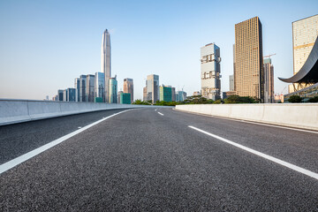 Fototapeta na wymiar Asphalt road and city skyline with modern commercial office buildings in Shenzhen, China.