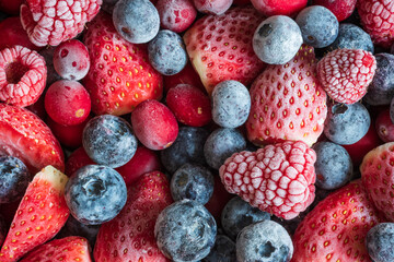 frozen mix strawberries blueberries raspberries and cranberries closeup
