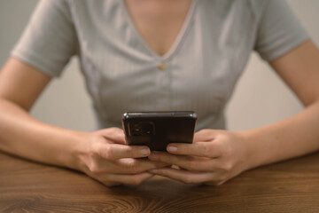 Businessman working with smartphone in office. Searching for information and customer list through social media.