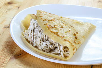 Pancake with chicken and sause