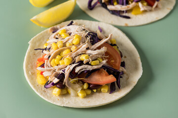 Tacos with Vegetables and Corn and Chicken on Green Background Horizontal