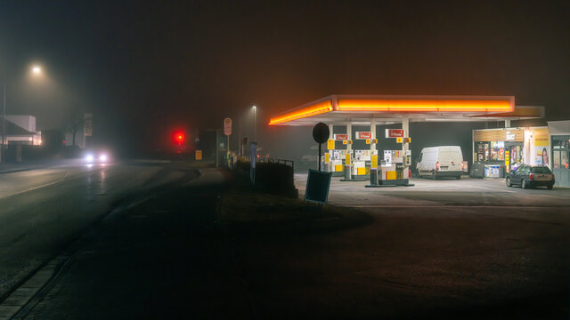 Royal Dutch Shell petrol station at night in fog