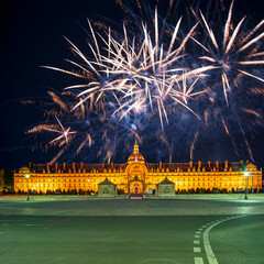 Fototapeta na wymiar Celebratory colorful fireworks over the Les Invalides (The National Residence of the Invalids) at night. Paris, France
