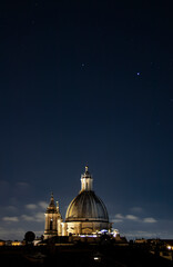 Starry night above church dome