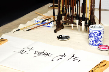 Traditional Chinese calligraphy, a character translation means focus your heart and develop your...