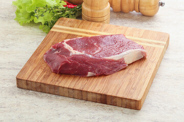 Raw rib-eye beef steak black angus