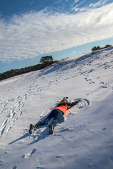 Girl making snow angel