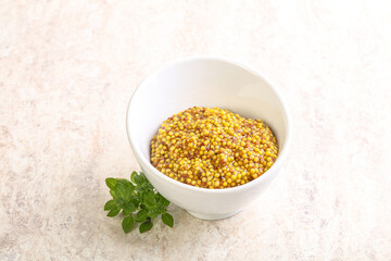 Grain mustard sauce in the bowl