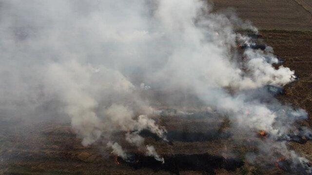 Aerial static shot of burning stubble in Nepal