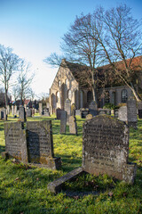 Old gravestones and church