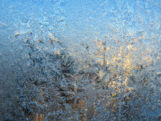 Winter frozen window covered with ice crystals