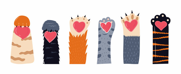 Heart and cats paw vector set. Pet feet in hand drawn style. Paws of fluffy, pretty, friendly kittens holding openwork heart.