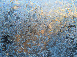 Winter frozen window covered with ice crystals