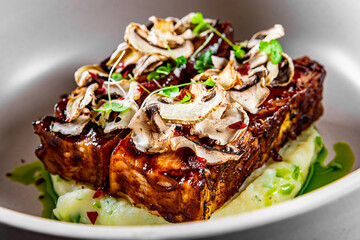 brisket and mashed potato on white plate.