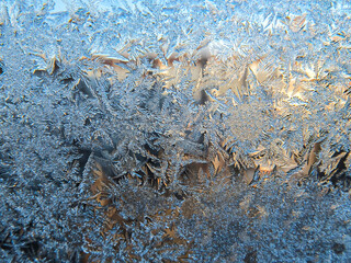 Winter frozen window covered with ice crystals