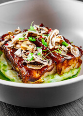 brisket and mashed potato on white plate.