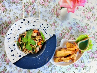 Menu menu, fried spaghetti and shrimp spring rolls, background view.