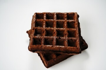 Chocolate waffles isolated on white, selective focus