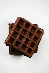 Chocolate waffles isolated on white, selective focus