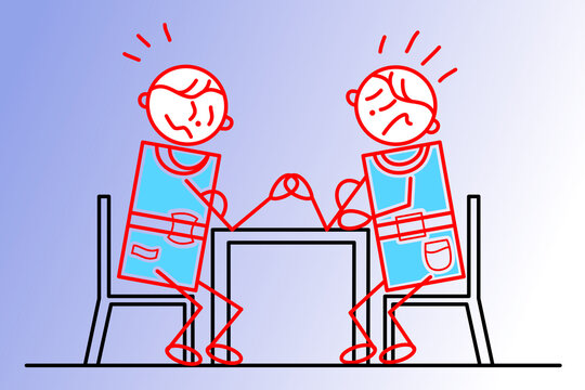 Two people sitting at a table are struggling. Arm wrestling concept image