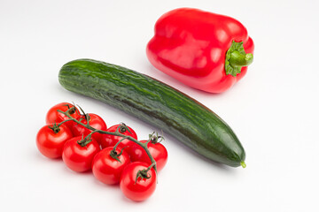 cucumber, sweet pepper, cherry tomatoes on a white background, isolated