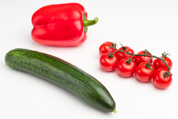 cucumber, sweet pepper, cherry tomatoes on a white background, isolated