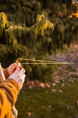 Man holding dowsing rod outside