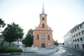 Fototapeta na wymiar Church facade in a small city Europe Christian cross